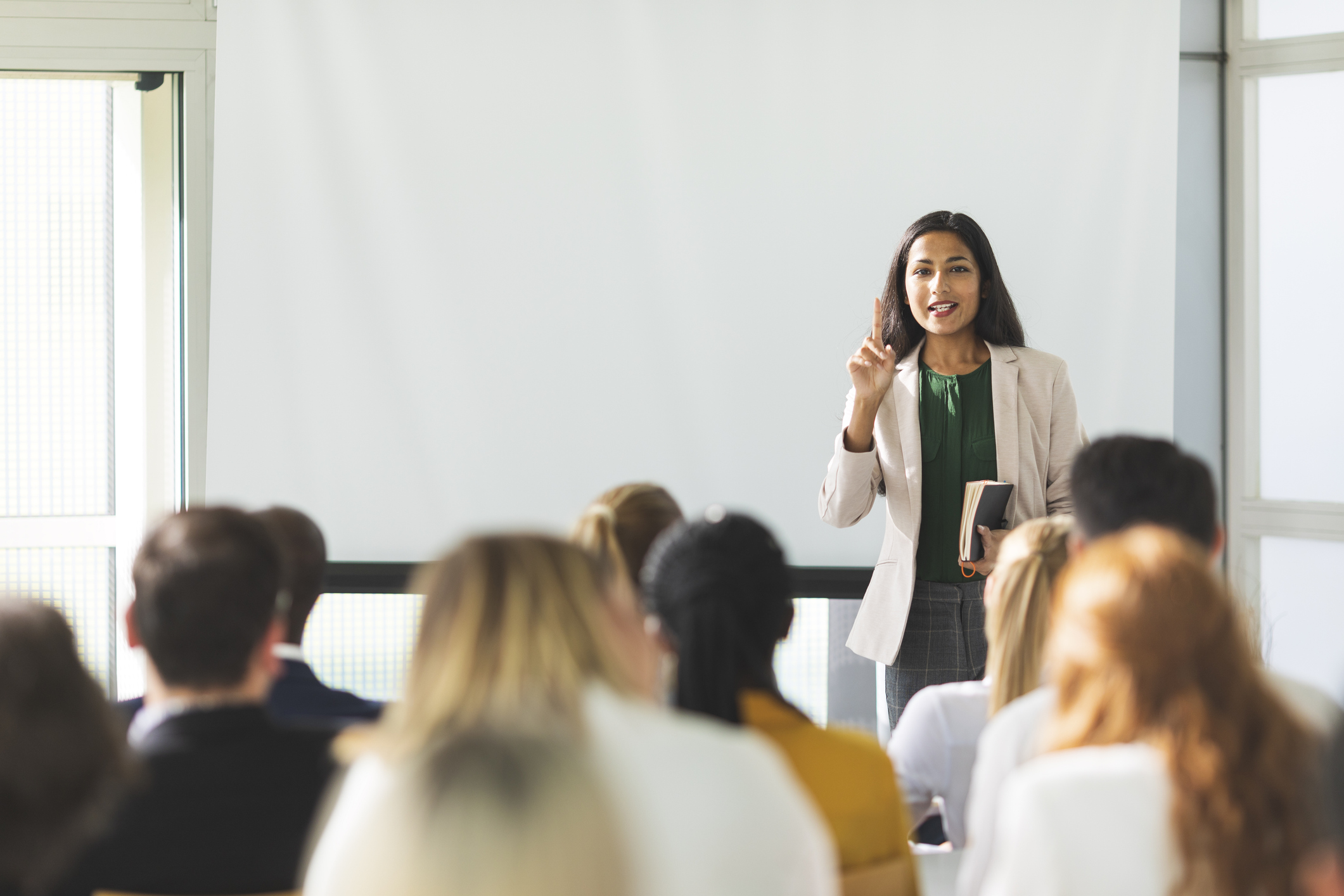Female Dr of Indian descent speaking at a Fertility Information Seminars