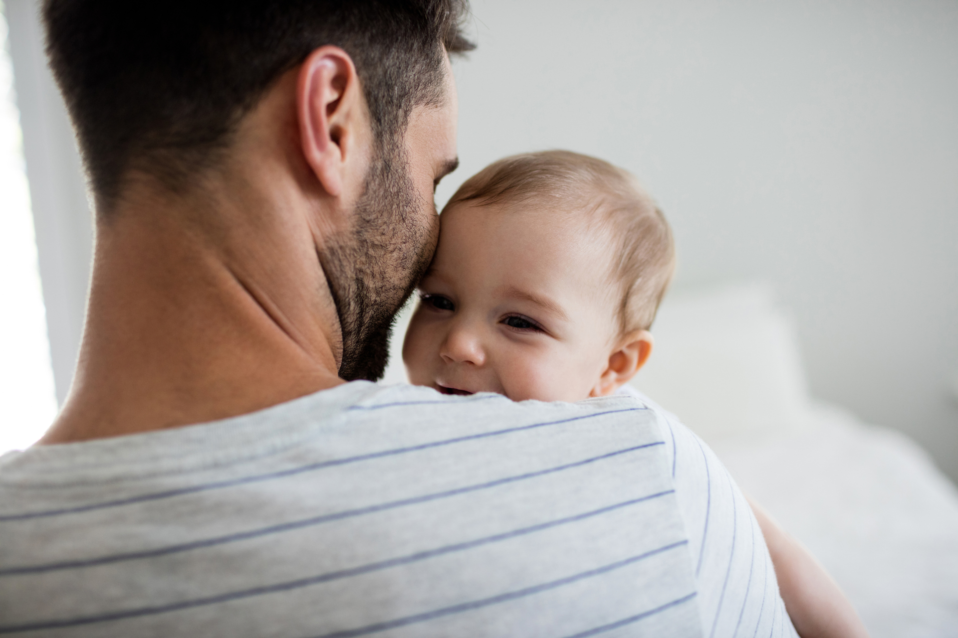 Young father holding baby