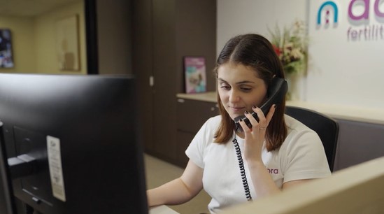 Woman reading Fertility Treatment brochure
